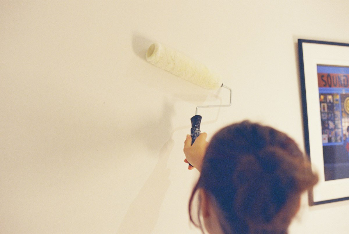 Painting a wall with a roller